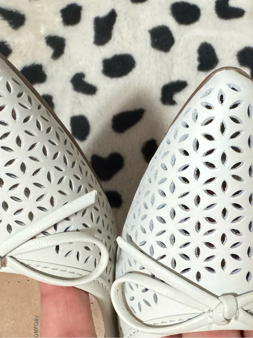 Comfortiva White Laser-Cut Bow Ballet Flats